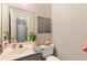 Bathroom with neutral tones, vanity and decorative mirror at 5539 Hurstcliffe Nw Dr, Kennesaw, GA 30152