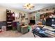 Bedroom featuring a ceiling fan, plush carpet, and large storage shelves at 5539 Hurstcliffe Nw Dr, Kennesaw, GA 30152