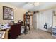 Bright bedroom featuring neutral walls, a built-in bookshelf, and a closet at 5539 Hurstcliffe Nw Dr, Kennesaw, GA 30152