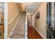 Inviting foyer featuring a staircase and hardwood floors, creating a warm and welcoming entrance at 5539 Hurstcliffe Nw Dr, Kennesaw, GA 30152