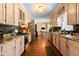 Long kitchen features light-colored wood cabinets and stainless appliances at 5539 Hurstcliffe Nw Dr, Kennesaw, GA 30152