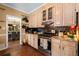 Kitchen featuring gas range, granite countertops and wood cabinets at 5539 Hurstcliffe Nw Dr, Kennesaw, GA 30152
