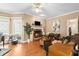 Inviting living room with a fireplace and hardwood floors, creating a warm and welcoming atmosphere for relaxing at 5539 Hurstcliffe Nw Dr, Kennesaw, GA 30152