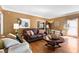 Warm and inviting living room with a comfortable leather sofa and stylish decor, perfect for relaxing and entertaining at 5539 Hurstcliffe Nw Dr, Kennesaw, GA 30152