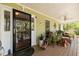 Relaxing covered porch with comfortable seating and stylish decor, offering a serene outdoor living space at 5539 Hurstcliffe Nw Dr, Kennesaw, GA 30152