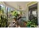 Charming covered porch with hanging plants and a ceiling fan, perfect for enjoying the outdoors at 5539 Hurstcliffe Nw Dr, Kennesaw, GA 30152