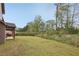 Expansive backyard featuring a lush lawn, perfect for outdoor activities and entertaining at 811 Holly Mist Ct, Loganville, GA 30052