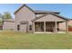 Covered patio, ideal for grilling and relaxing outdoors at 811 Holly Mist Ct, Loganville, GA 30052