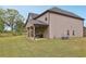 The spacious backyard features a patio perfect for outdoor entertaining at 811 Holly Mist Ct, Loganville, GA 30052