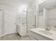 Bathroom with double sink vanity, large mirror, and updated finishes at 811 Holly Mist Ct, Loganville, GA 30052