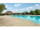 Sparkling community pool with water slide and covered seating area at 811 Holly Mist Ct, Loganville, GA 30052
