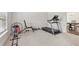 Exercise room featuring a treadmill, free weights, and ample natural light at 811 Holly Mist Ct, Loganville, GA 30052