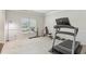 Exercise room featuring a treadmill, free weights, and ample natural light at 811 Holly Mist Ct, Loganville, GA 30052