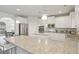 Bright kitchen featuring white cabinets, stainless appliances, granite counters, and an island at 811 Holly Mist Ct, Loganville, GA 30052