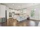 Bright eat-in kitchen featuring white cabinets, stainless appliances, granite counters, and a large island at 811 Holly Mist Ct, Loganville, GA 30052