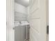 Convenient laundry room with a modern washing machine and dryer at 811 Holly Mist Ct, Loganville, GA 30052