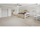 Bright main bedroom featuring plush carpet, neutral paint, and an ensuite bathroom at 811 Holly Mist Ct, Loganville, GA 30052