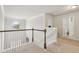 Upstairs hallway and landing area with access to bedrooms and baths at 811 Holly Mist Ct, Loganville, GA 30052