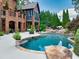 Gorgeous swimming pool, patio and beautifully landscaped backyard. Ideal for relaxation and summer fun at 2740 Drayton Hall Dr, Buford, GA 30519
