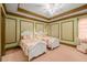 Charming bedroom featuring two ornate white beds, floral wallpaper, and a pastel patterned carpet at 2740 Drayton Hall Dr, Buford, GA 30519