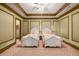 Charming bedroom featuring two ornate white beds, floral wallpaper, and a pastel patterned carpet at 2740 Drayton Hall Dr, Buford, GA 30519