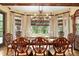 Formal dining area featuring hardwood floors, large windows, and custom dining set at 2740 Drayton Hall Dr, Buford, GA 30519