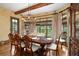 Formal dining area featuring hardwood floors, custom dining set, and large windows at 2740 Drayton Hall Dr, Buford, GA 30519