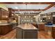 Gourmet kitchen featuring a large island with tile countertops, custom cabinets, and breakfast bar at 2740 Drayton Hall Dr, Buford, GA 30519