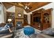 Charming living room featuring a stone fireplace, vaulted ceilings, and built-in wooden cabinetry at 2740 Drayton Hall Dr, Buford, GA 30519