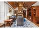 Bright living room with stone fireplace, coffered ceiling, hardwood floors, and custom millwork at 2740 Drayton Hall Dr, Buford, GA 30519