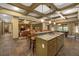 Open floor plan with a kitchen island, dining area, sitting area, and pool table for entertaining at 2740 Drayton Hall Dr, Buford, GA 30519