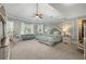 Spacious main bedroom featuring a sitting area, large windows, and soft colors at 2740 Drayton Hall Dr, Buford, GA 30519