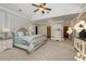 Beautiful main bedroom with sitting area, trey ceiling, and stylish decor at 2740 Drayton Hall Dr, Buford, GA 30519