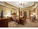 Inviting main bedroom with a four-poster bed, elegant furnishings, and a cozy sitting area at 2740 Drayton Hall Dr, Buford, GA 30519