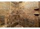 Luxurious tiled shower with built-in seating and shower caddy at 2740 Drayton Hall Dr, Buford, GA 30519