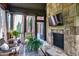 Relaxing sunroom with stone fireplace and views of the surrounding property at 2740 Drayton Hall Dr, Buford, GA 30519