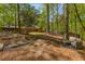 Backyard features stone pavers, a hammock, and an outdoor seating area at 3444 Wood Acres Blvd, Duluth, GA 30096