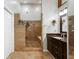 Luxurious bathroom features a travertine shower and granite vanity at 3444 Wood Acres Blvd, Duluth, GA 30096