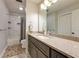 Bathroom featuring granite countertops, a bath and shower, and tile floors at 3444 Wood Acres Blvd, Duluth, GA 30096