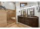 Beautiful bathroom with dual sink vanity, travertine shower, and modern fixtures at 3444 Wood Acres Blvd, Duluth, GA 30096
