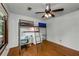 Bedroom features a ladder to bunk bed, a ceiling fan and gleaming hardwood floors at 3444 Wood Acres Blvd, Duluth, GA 30096