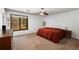 Bright bedroom with large window, ceiling fan and minimalist decor at 3444 Wood Acres Blvd, Duluth, GA 30096