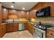 Modern kitchen with granite countertops, stainless steel appliances, and custom cabinetry at 3444 Wood Acres Blvd, Duluth, GA 30096