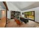 Home office with built-in bookshelves and view to the backyard at 3444 Wood Acres Blvd, Duluth, GA 30096