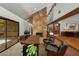 Home office with stone fireplace and high ceilings is ideal for working from home at 3444 Wood Acres Blvd, Duluth, GA 30096