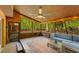 Spacious sunroom features a ceiling fan, cozy seating and sliding screen doors at 3444 Wood Acres Blvd, Duluth, GA 30096