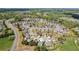 Aerial view showcasing the property's location within a well-maintained community, near a pond at 4580 Orchard Ridge Ct, Cumming, GA 30028