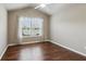 Cozy bedroom featuring ceiling fan, wood flooring and window at 4580 Orchard Ridge Ct, Cumming, GA 30028