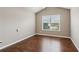 Bedroom featuring wood flooring and large window at 4580 Orchard Ridge Ct, Cumming, GA 30028
