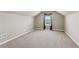 Spacious bonus room with neutral carpet and vaulted ceiling at 4580 Orchard Ridge Ct, Cumming, GA 30028